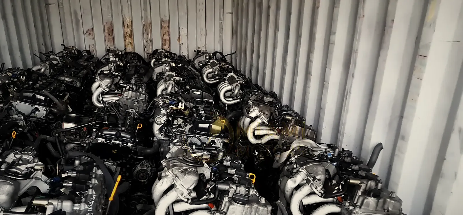 Inside a Miami Motors export container, packed with engines